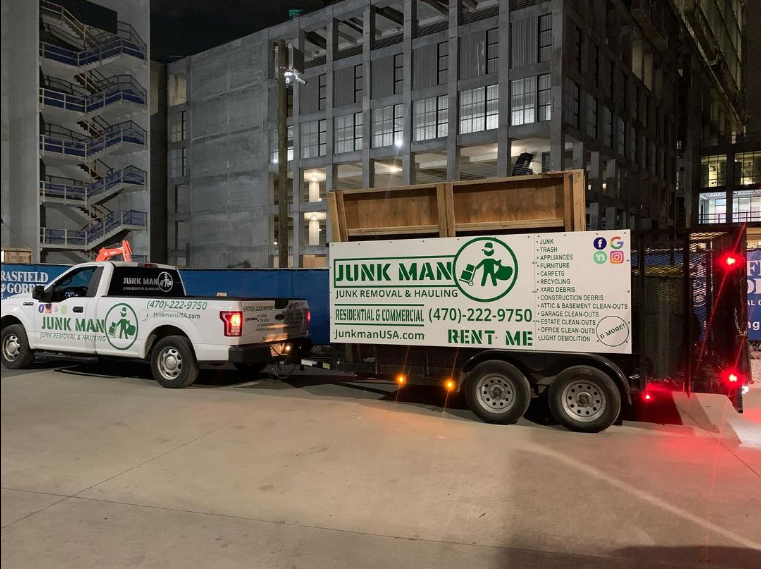 Junk Man removing Junk at a commercial property, dumpster rental. The best junk removal services in the Metro Atlanta area